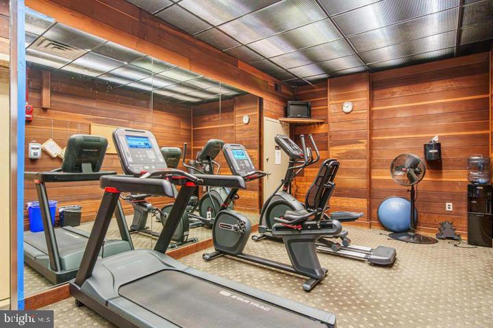 700 7th Street Southwest, Unit 432 Washington, DC 20024 - Photo 5 of 33 Modern fitness space with wooden accents.