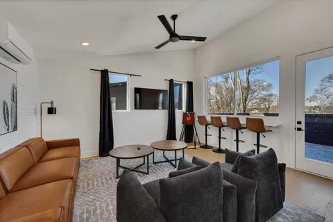 a living room with furniture and a large window