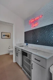 a view of a kitchen with stove and cabinets
