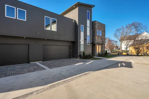 a front view of a building with a road