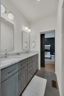 a en suite bathroom with a sink and a mirror