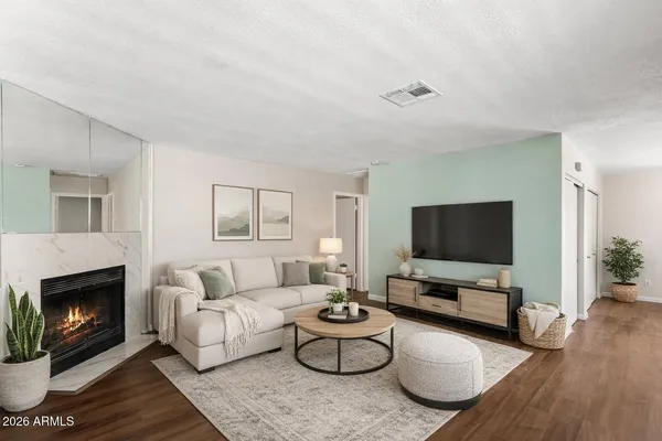 a kitchen with granite countertop a stove a sink and a microwave