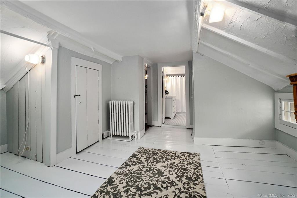 2 Deforest Road Wilton, CT 06897 - Photo 21 of 37 a view of a hallway with a livingroom and a window