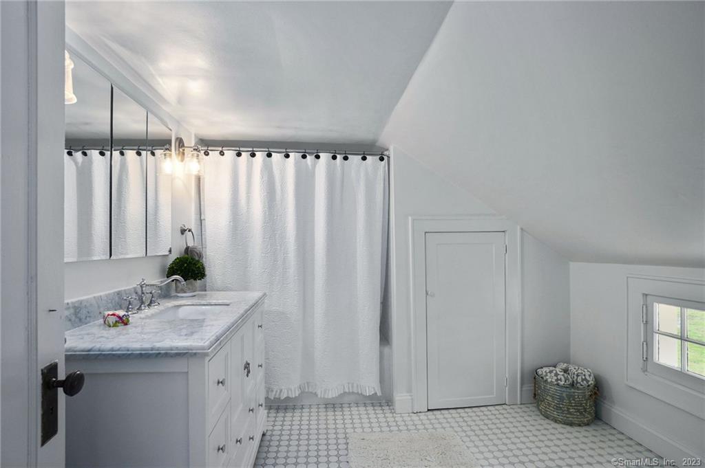 2 Deforest Road Wilton, CT 06897 - Photo 22 of 37 a bathroom with a sink and a mirror