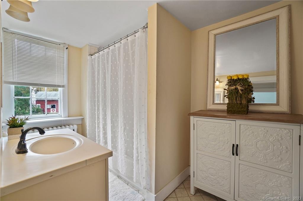 2 Deforest Road Wilton, CT 06897 - Photo 25 of 37 a view of a sink and a mirror