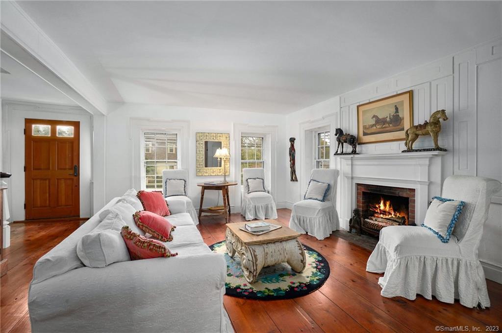 2 Deforest Road Wilton, CT 06897 - Photo 3 of 37 a living room with furniture and a fireplace