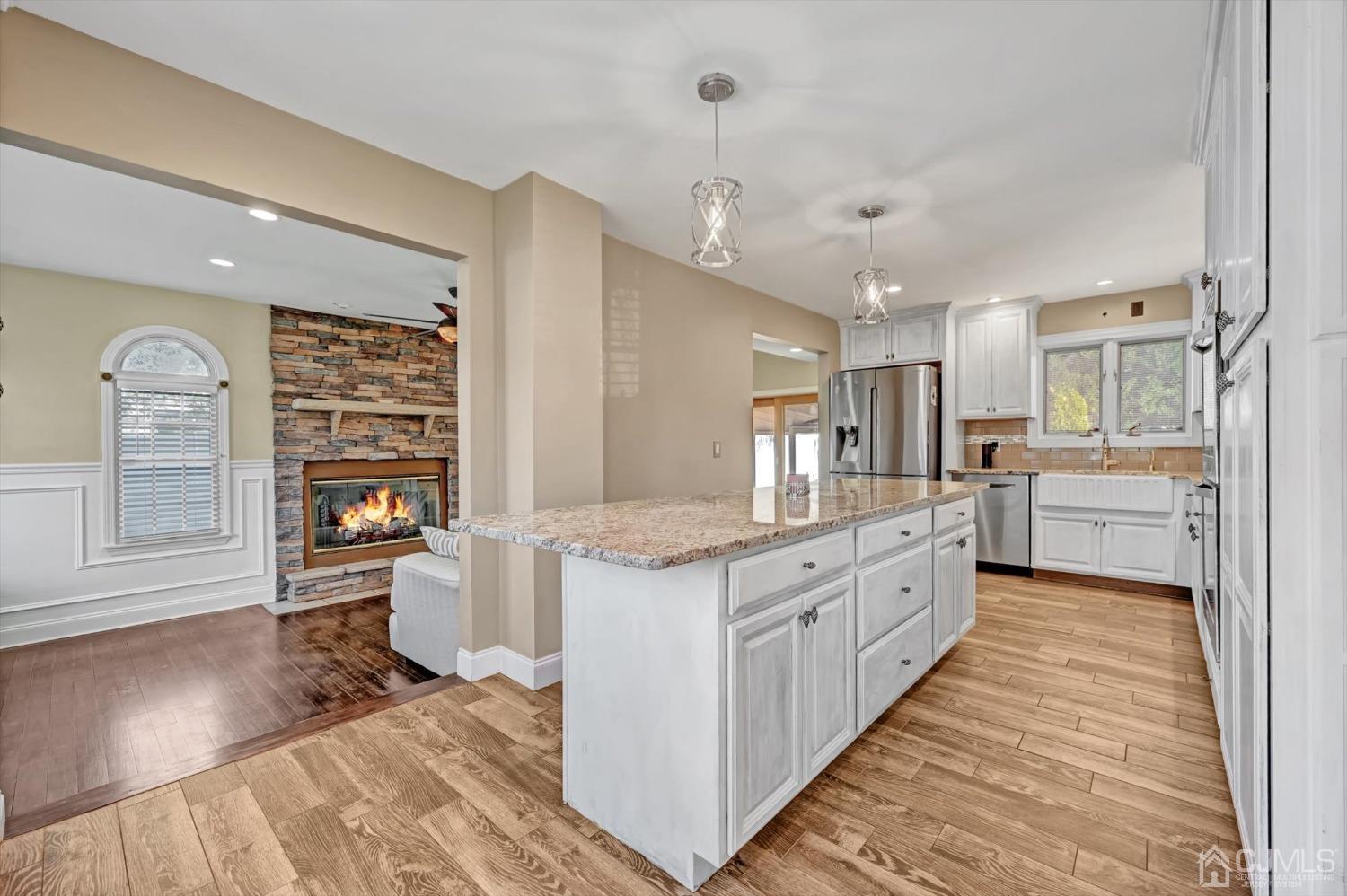 40 Grace Drive Old Bridge, NJ 08857 - Photo 15 of 41 a large kitchen with stainless steel appliances granite countertop a lot of counter space and wooden floors