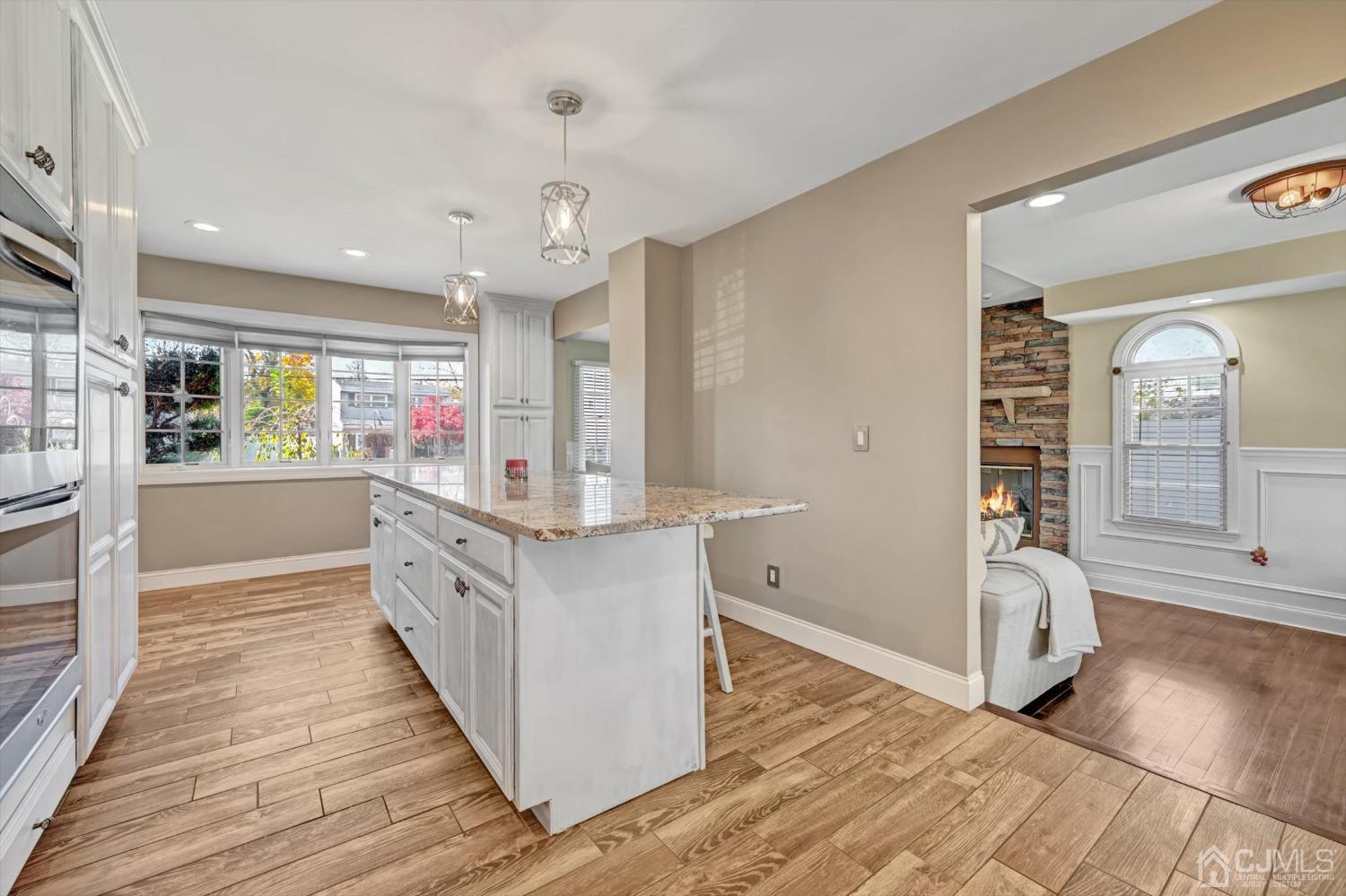 40 Grace Drive Old Bridge, NJ 08857 - Photo 16 of 41 a kitchen with stainless steel appliances granite countertop a stove and a wooden floors