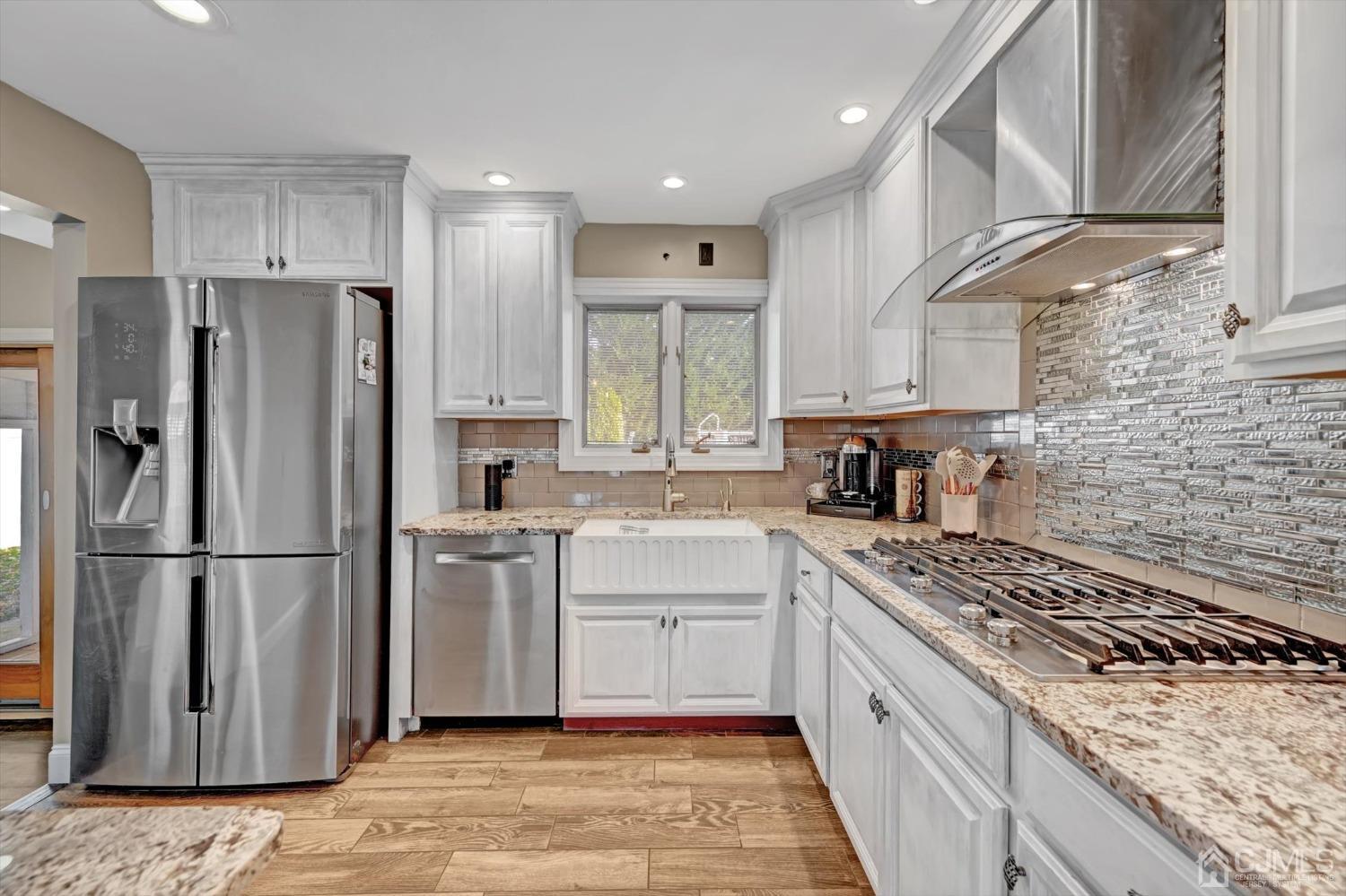 40 Grace Drive Old Bridge, NJ 08857 - Photo 18 of 41 a kitchen with stainless steel appliances granite countertop a stove a refrigerator and a sink