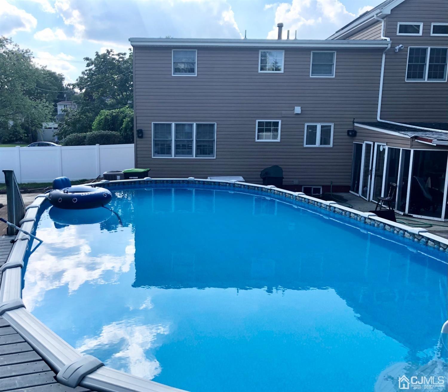 40 Grace Drive Old Bridge, NJ 08857 - Photo 34 of 41 a backyard of a house with table and chairs