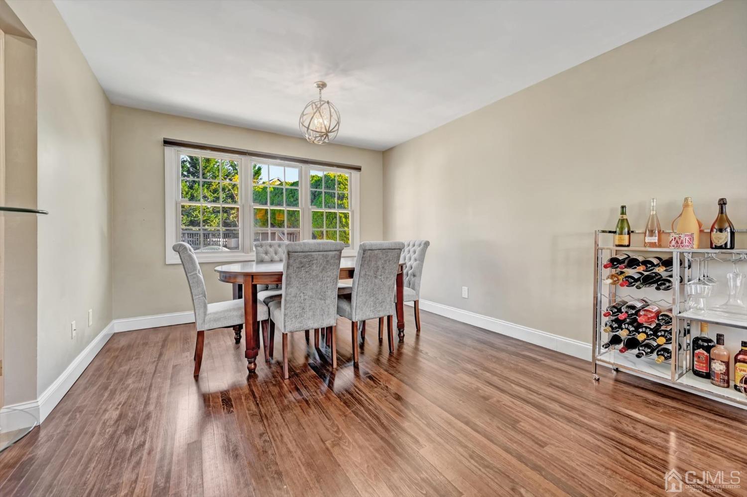 40 Grace Drive Old Bridge, NJ 08857 - Photo 7 of 41 a view of a dining room with furniture window and wooden floor