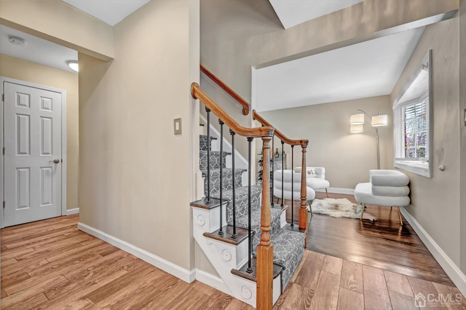 40 Grace Drive Old Bridge, NJ 08857 - Photo 9 of 41 a view of a hallway with living room and wooden floor