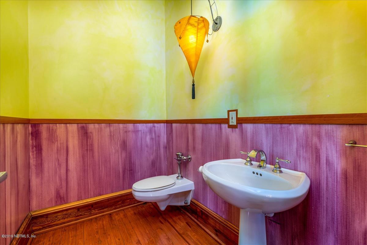 39 Adams Street Jacksonville, FL 32202 - Photo 16 of 29 a bathroom with a sink and a mirror