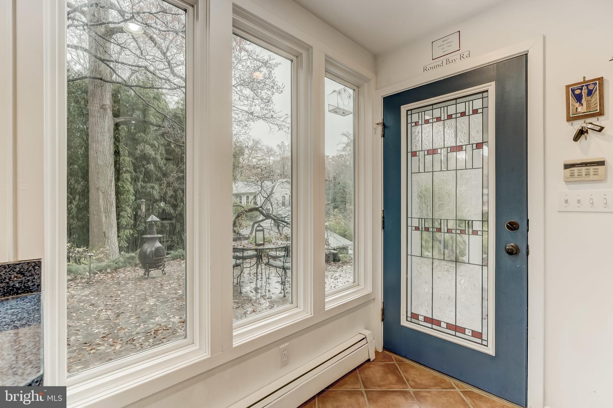 126 Round Bay Road Severna Park, MD 21146 - Photo 26 of 80 Windows frame the serene outdoor setting