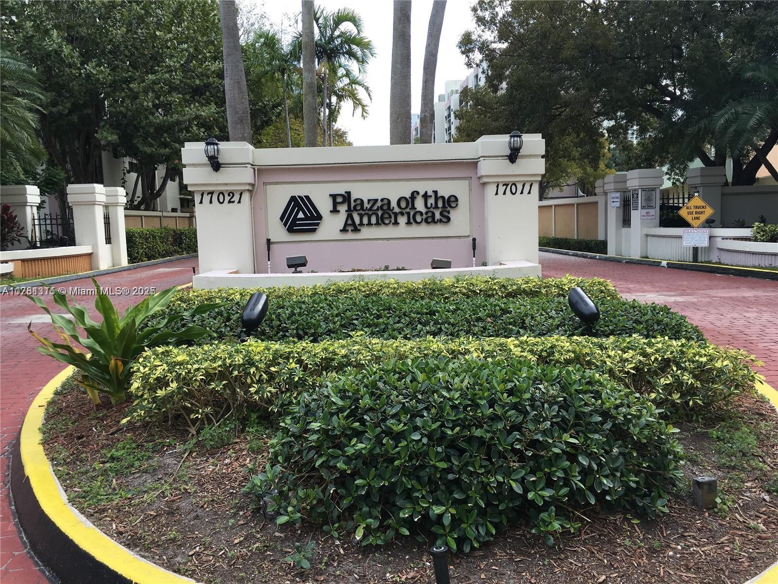 17011 North Bay Road, Unit 701 Sunny Isles Beach, FL 33160 - Photo 19 of 41 a sign that is sitting in front of flowers