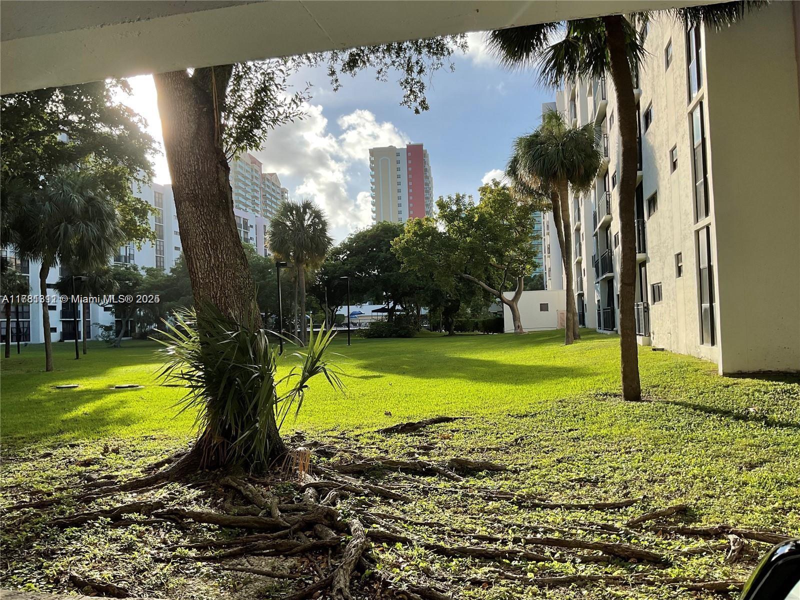 17011 North Bay Road, Unit 701 Sunny Isles Beach, FL 33160 - Photo 37 of 41 a view of a yard with a fountain