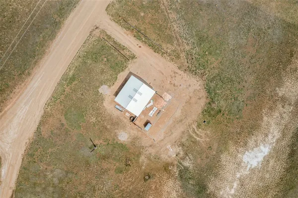a backyard of a house with a yard and garage