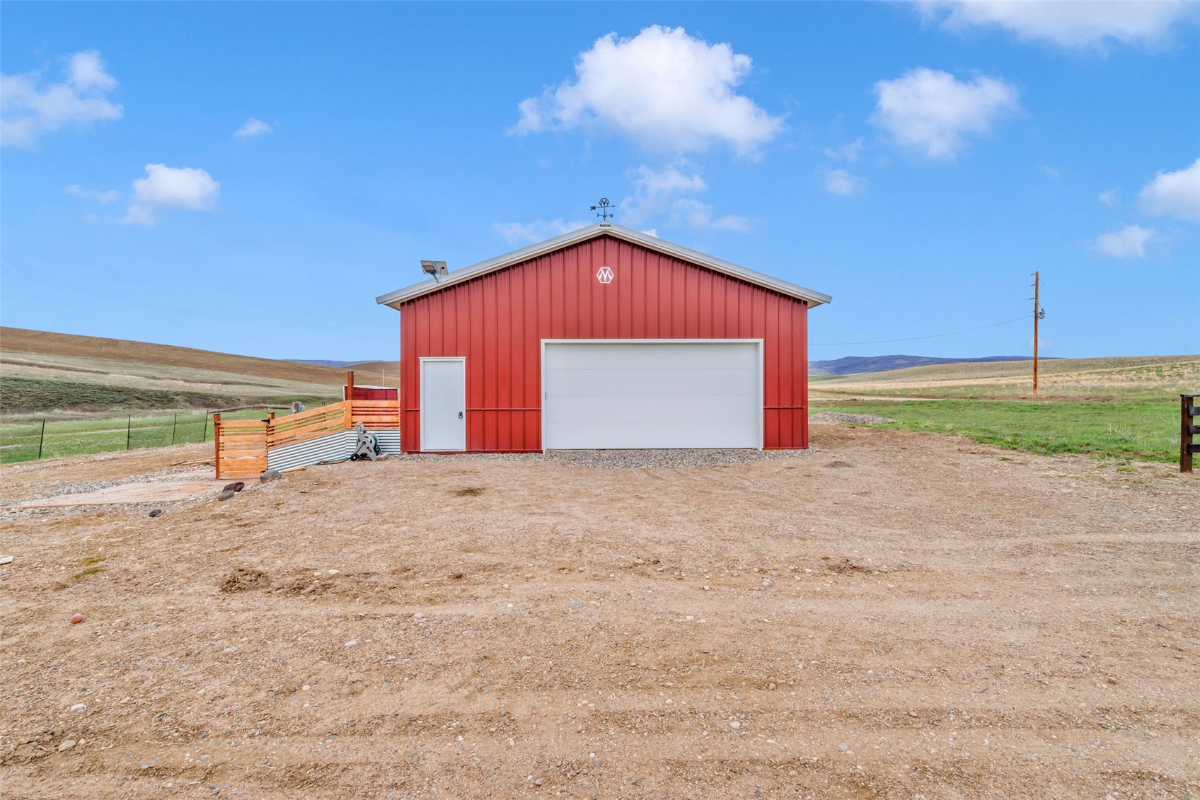 35000 County Road 59 Hayden, CO 81639 - Photo 14 of 18 a backyard of a house with a yard and garage