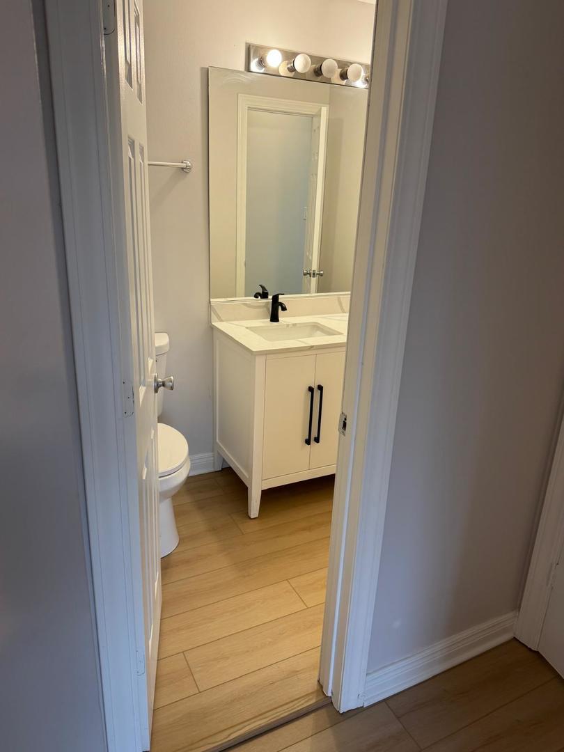 1935 North Hicks Road, Unit 106 Palatine, IL 60074 - Photo 13 of 16 a bathroom with a sink and a mirror