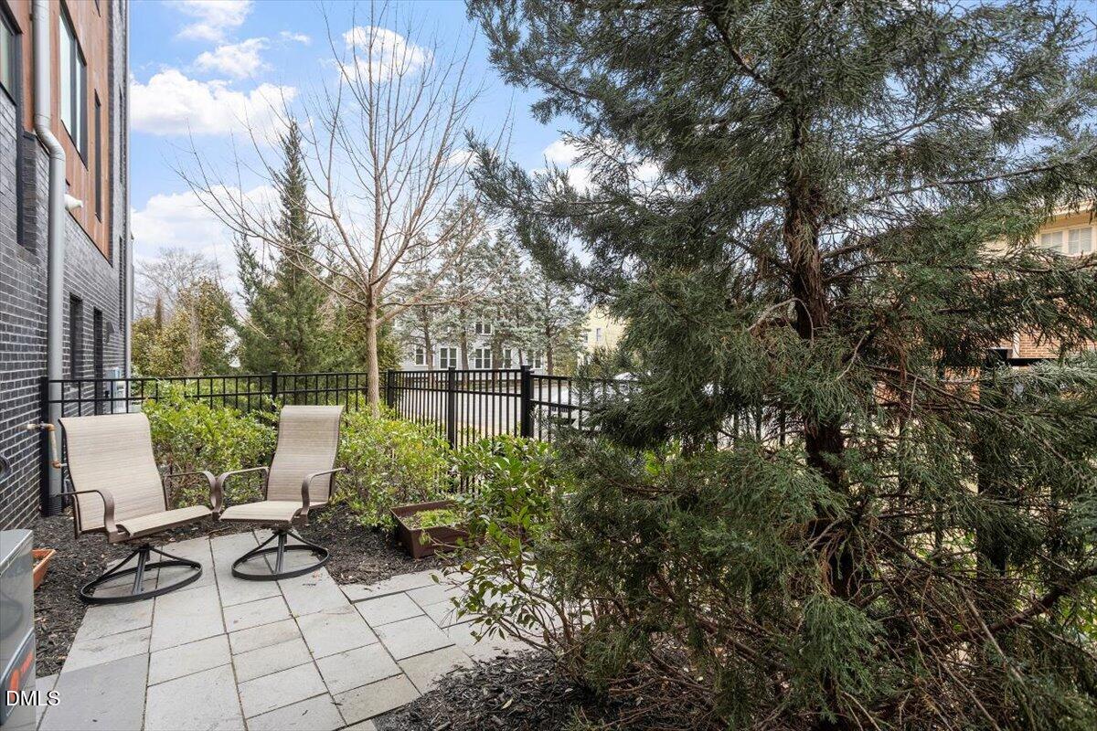 206 Dundas Lane Raleigh, NC 27603 - Photo 28 of 30 a view of backyard of house with seating space