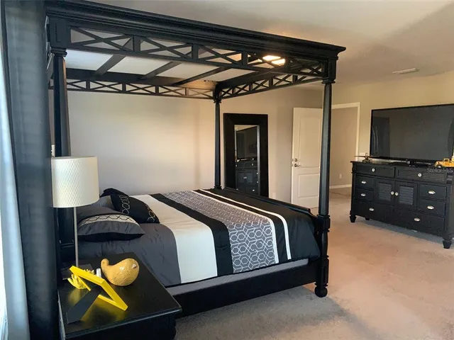 a spacious bathroom with a double vanity sink and a mirror