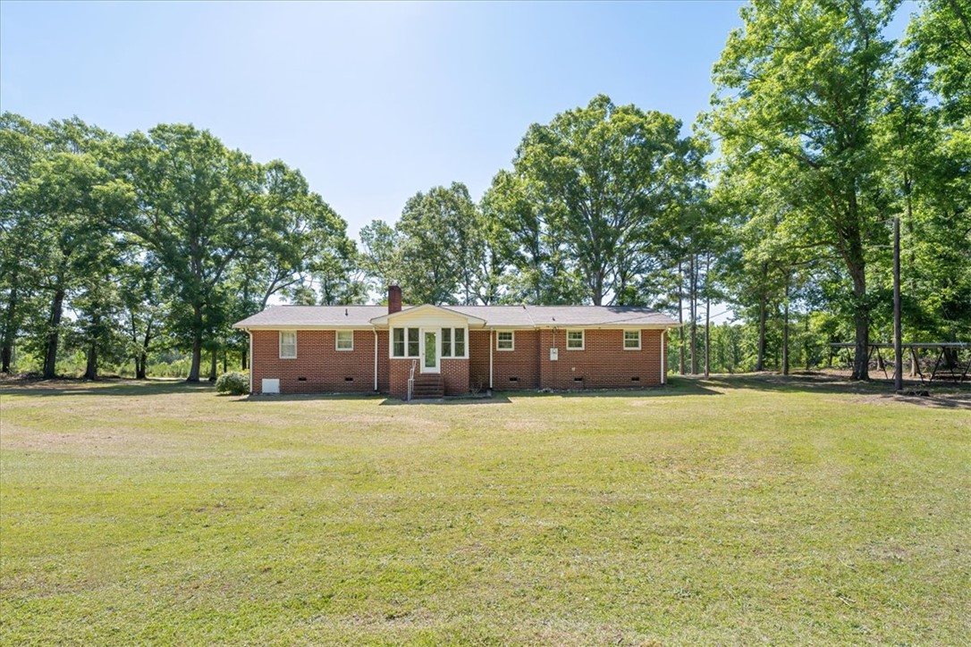 304 Shaw Road Honea Path, SC 29654 - Photo 33 of 39 This classic brick residence sits on an expansive lot surrounded by mature trees.