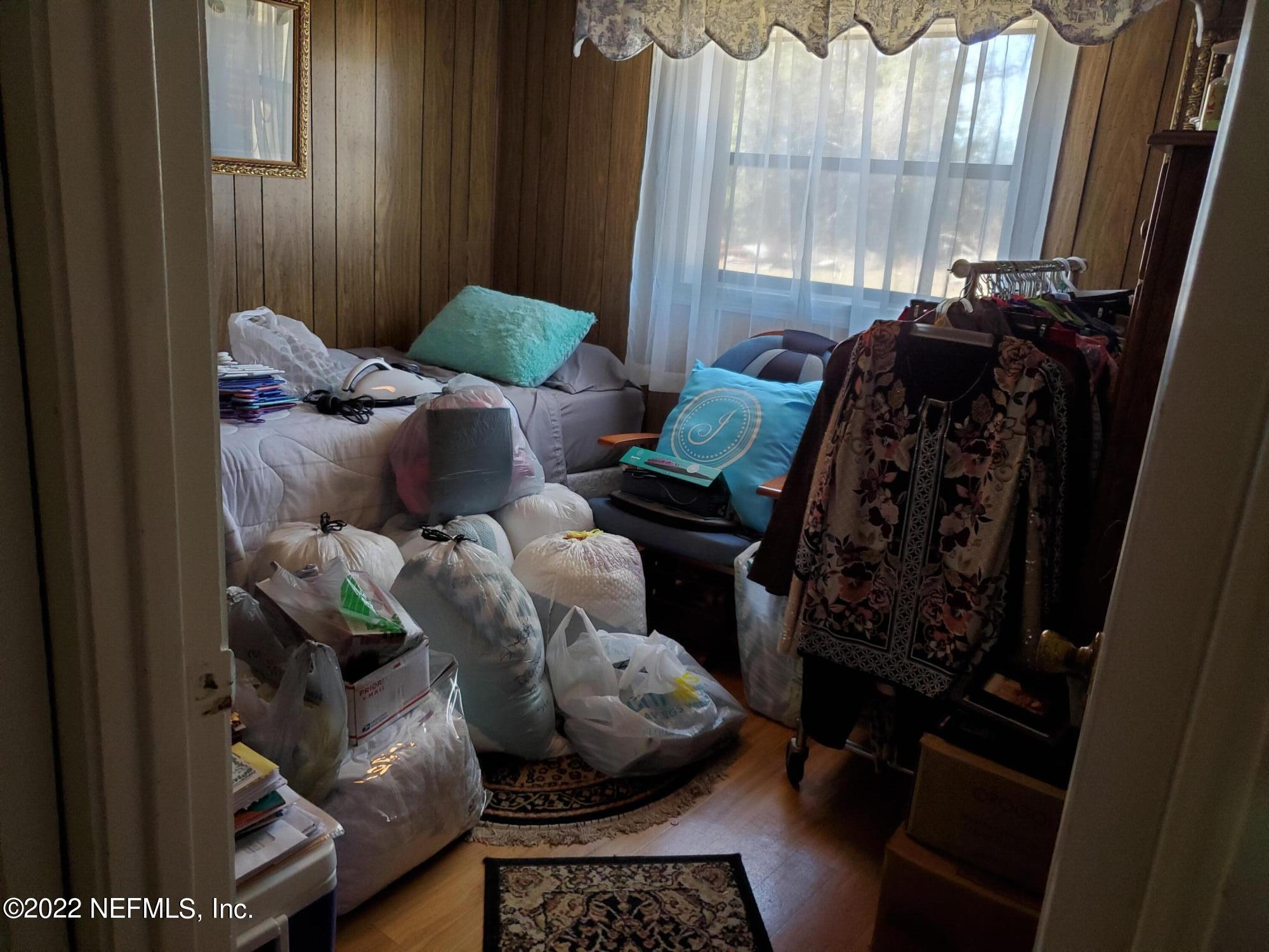 106 Comer Road Palatka, FL 32177 - Photo 16 of 19 a bed room with furniture and a window