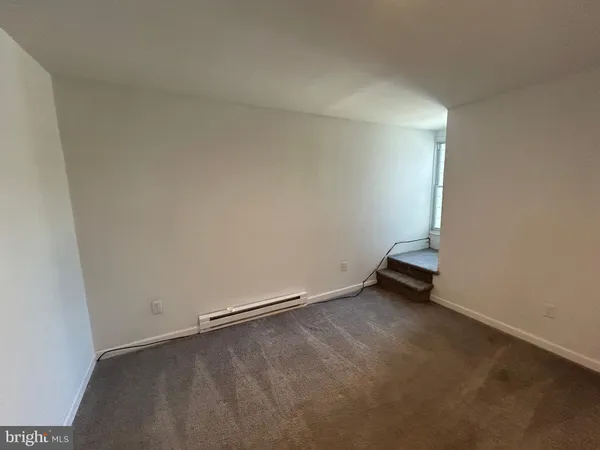 an empty room with a bench