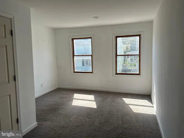 an empty room with windows