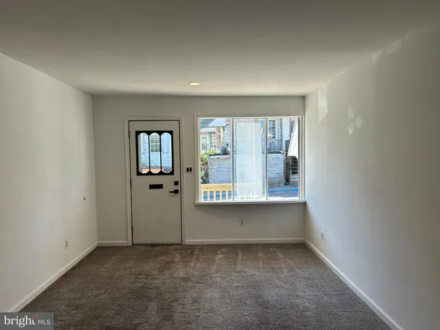 an empty room that has a window