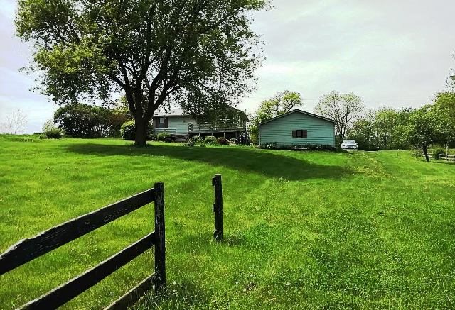 10009 Center Road Durand, IL 61024 - Photo 6 of 25 a view of a garden with a house in the background