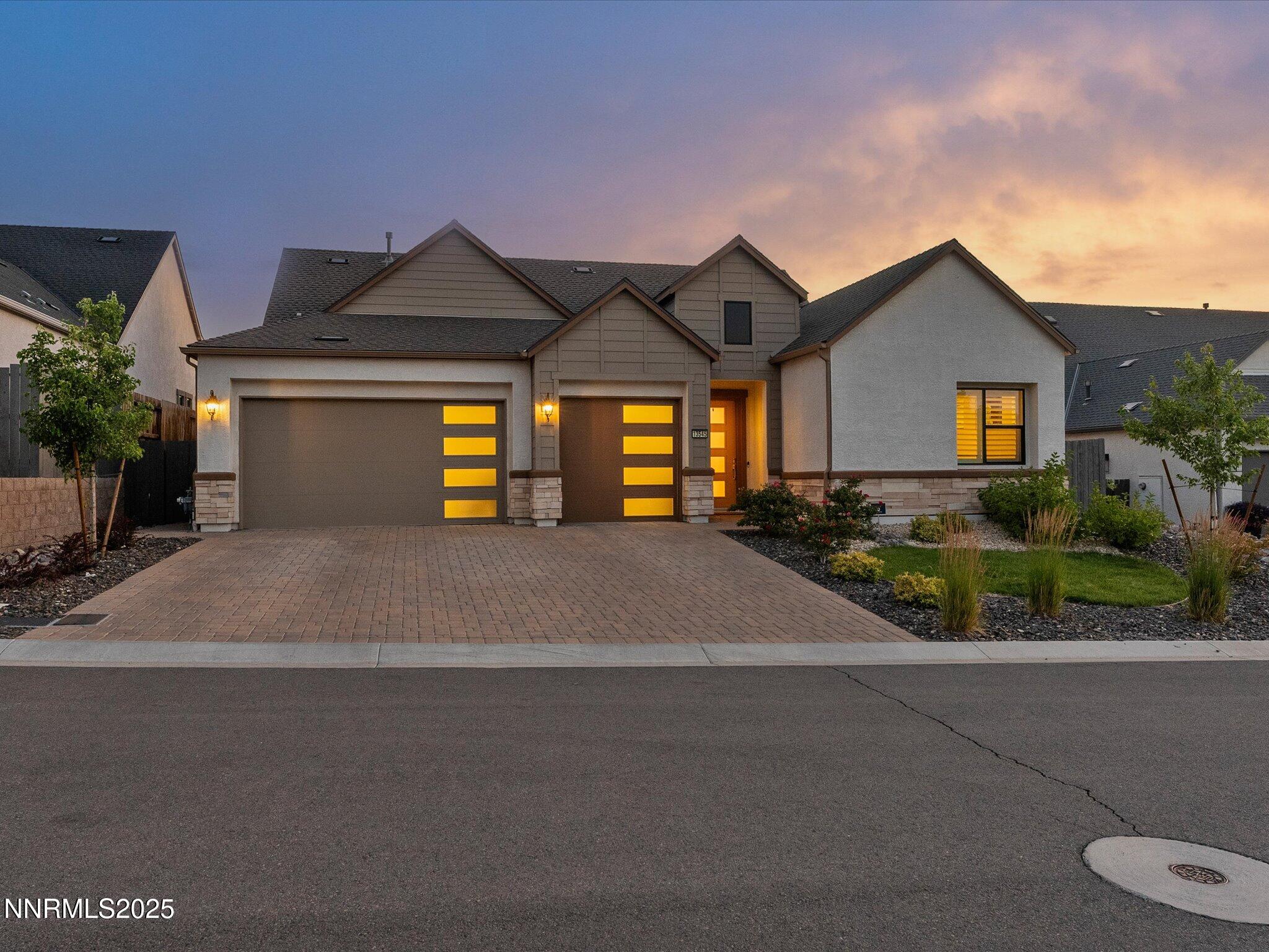 13545 Cobalt Sky Street Reno, NV 89521 - Photo 13 of 96 a front view of a house with garden