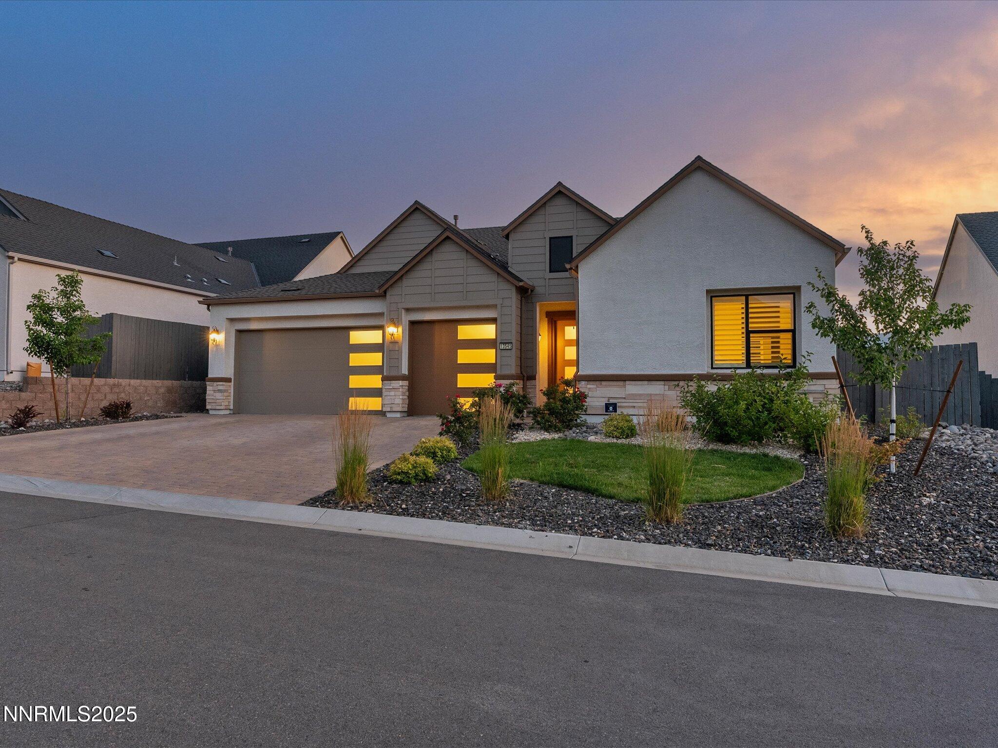 13545 Cobalt Sky Street Reno, NV 89521 - Photo 14 of 96 a front view of a house with garden