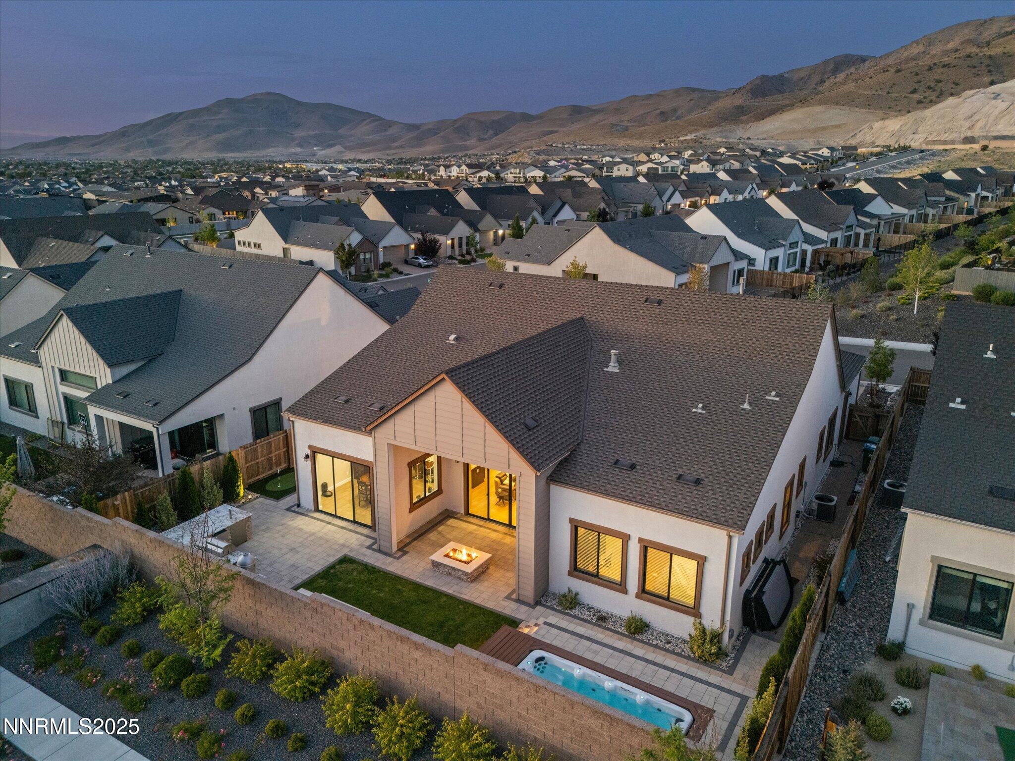 13545 Cobalt Sky Street Reno, NV 89521 - Photo 20 of 96 an aerial view of multiple houses with a city