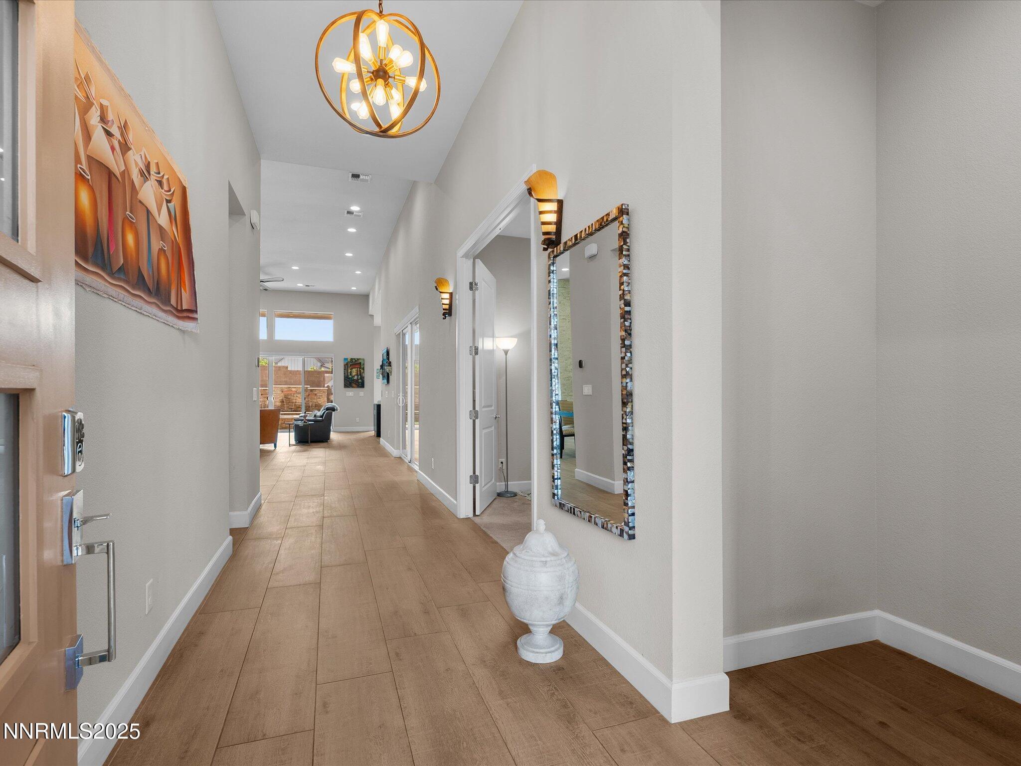 13545 Cobalt Sky Street Reno, NV 89521 - Photo 25 of 96 a view of an entryway with wooden floor