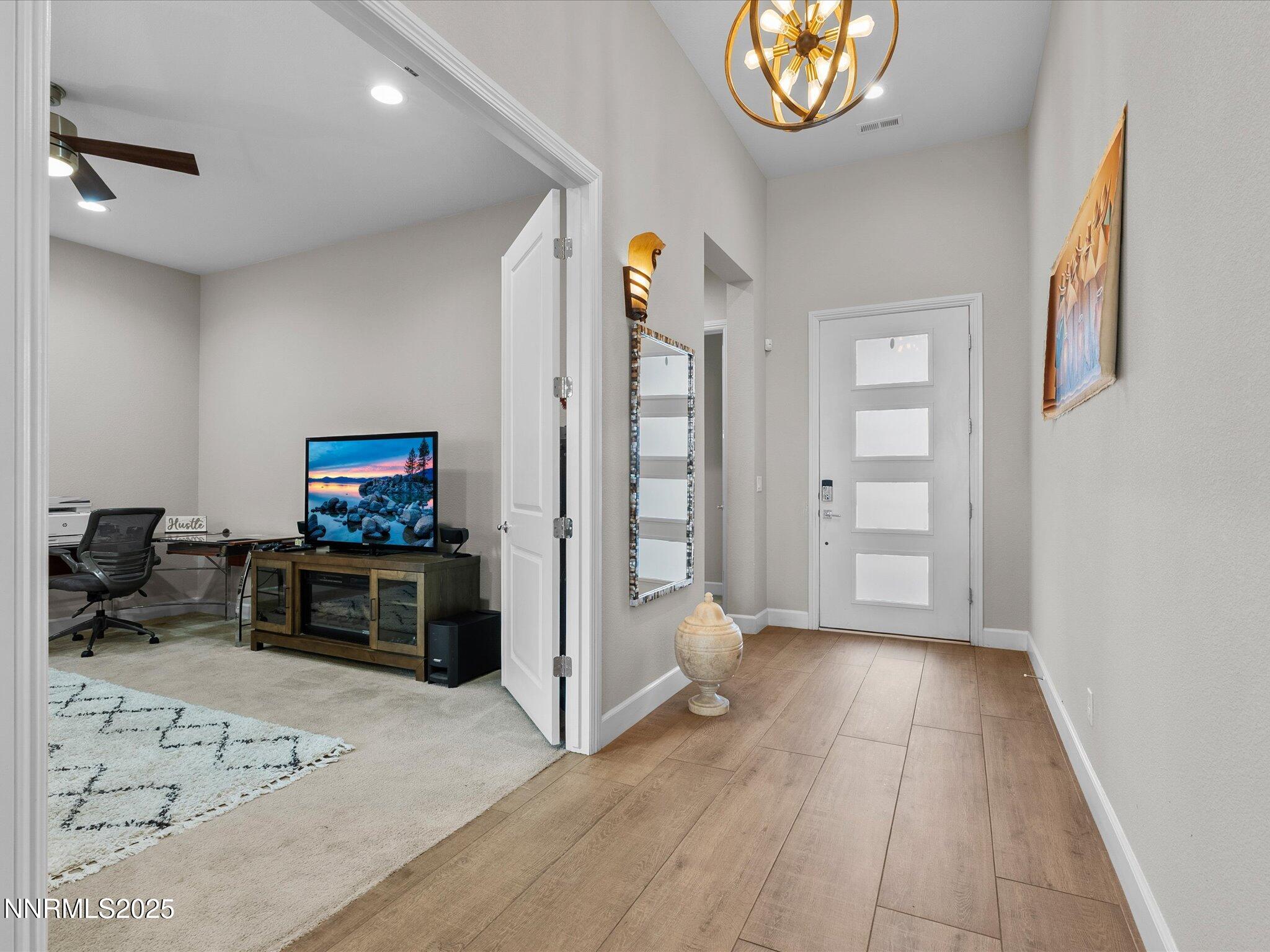 13545 Cobalt Sky Street Reno, NV 89521 - Photo 26 of 96 a view of a livingroom with furniture and a flat screen tv