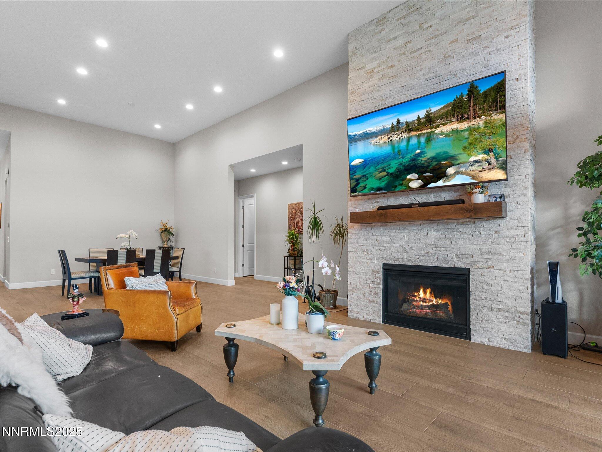 13545 Cobalt Sky Street Reno, NV 89521 - Photo 35 of 96 a living room with furniture a flat screen tv and a fireplace