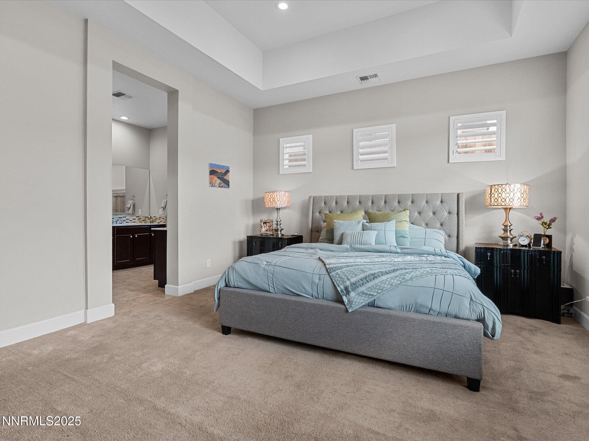 13545 Cobalt Sky Street Reno, NV 89521 - Photo 45 of 96 a bedroom with a bed and a lamp