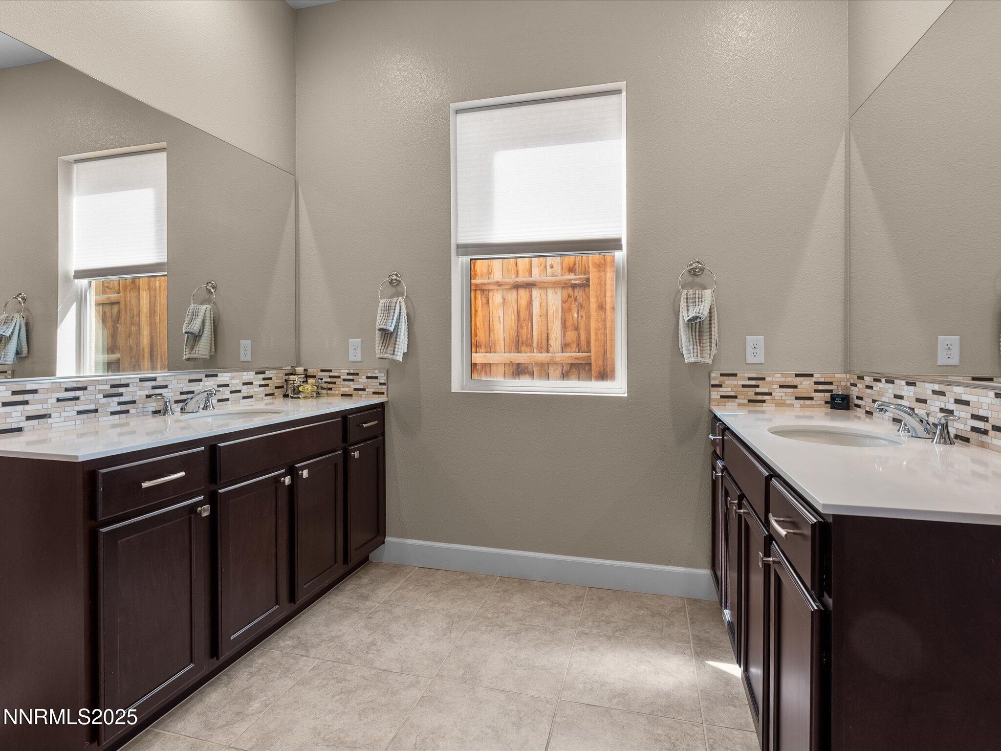 13545 Cobalt Sky Street Reno, NV 89521 - Photo 48 of 96 a bathroom with a sink a vanity and a mirror
