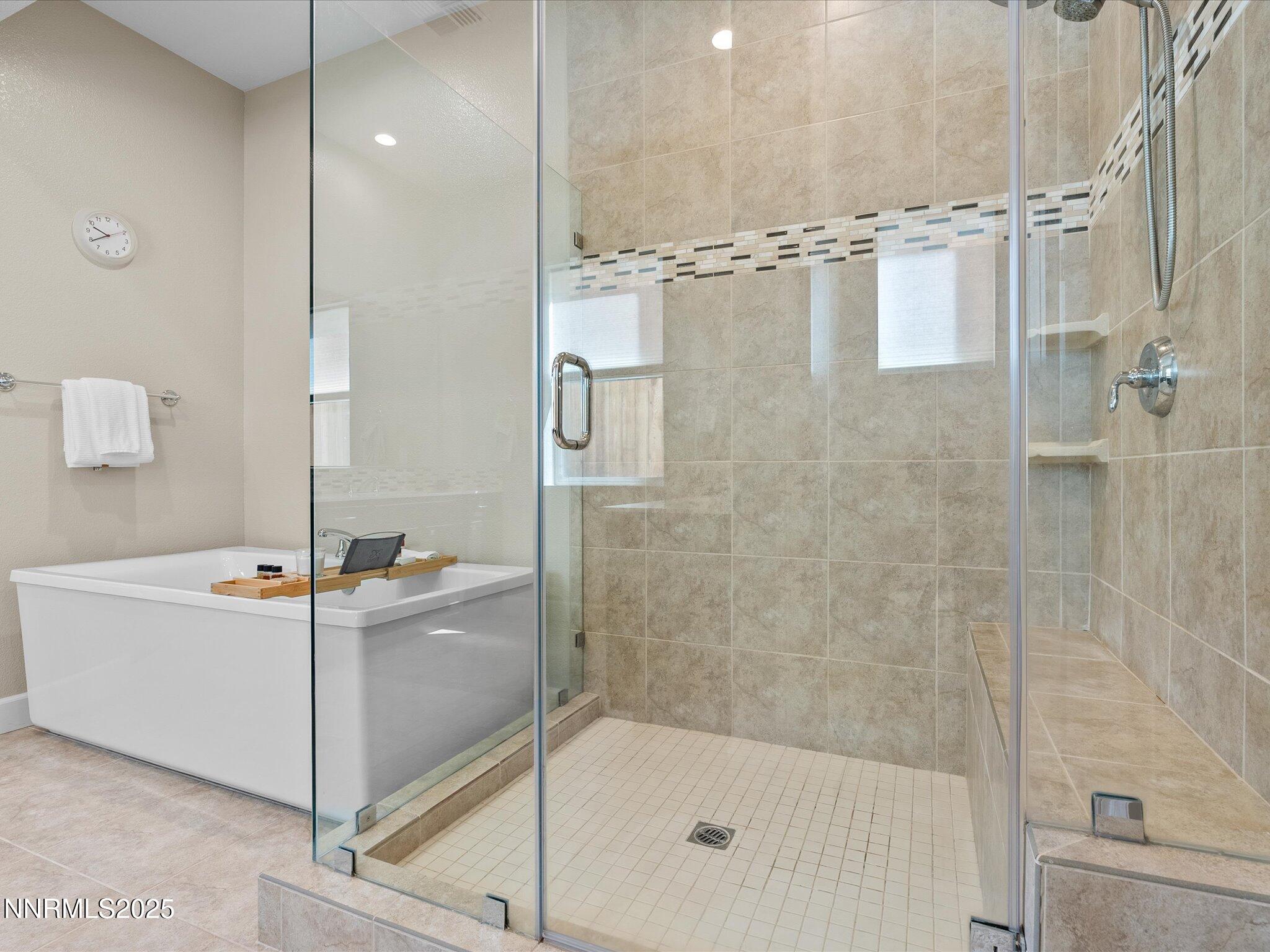 13545 Cobalt Sky Street Reno, NV 89521 - Photo 50 of 96 a bathroom with a bathtub and a shower