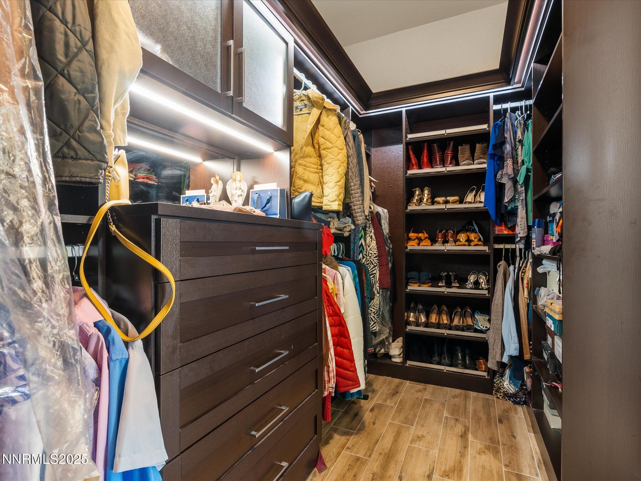 13545 Cobalt Sky Street Reno, NV 89521 - Photo 54 of 96 a view of walk in closet with clothes and shoes