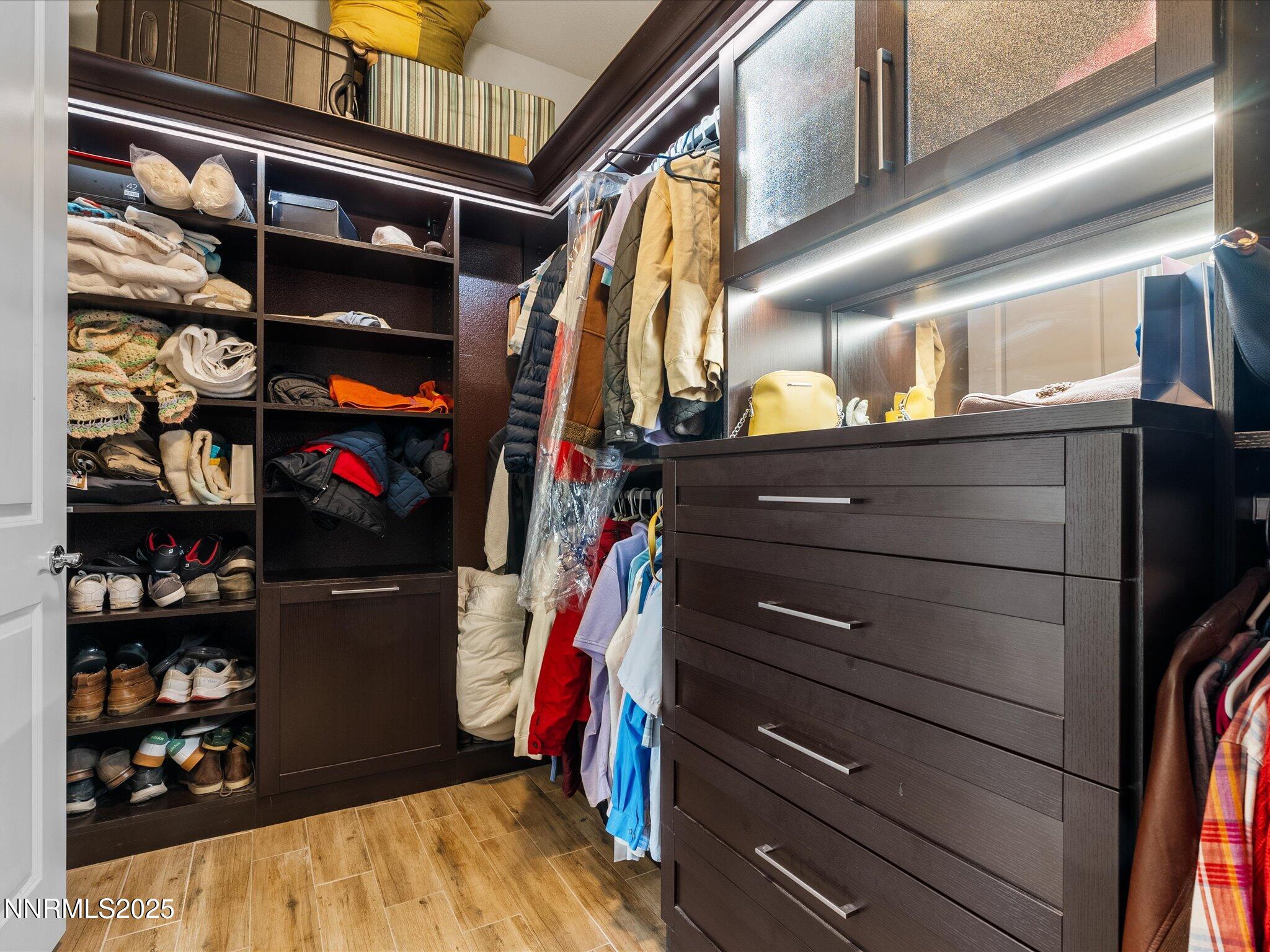13545 Cobalt Sky Street Reno, NV 89521 - Photo 55 of 96 a view of walk in closet with clothes and shoes
