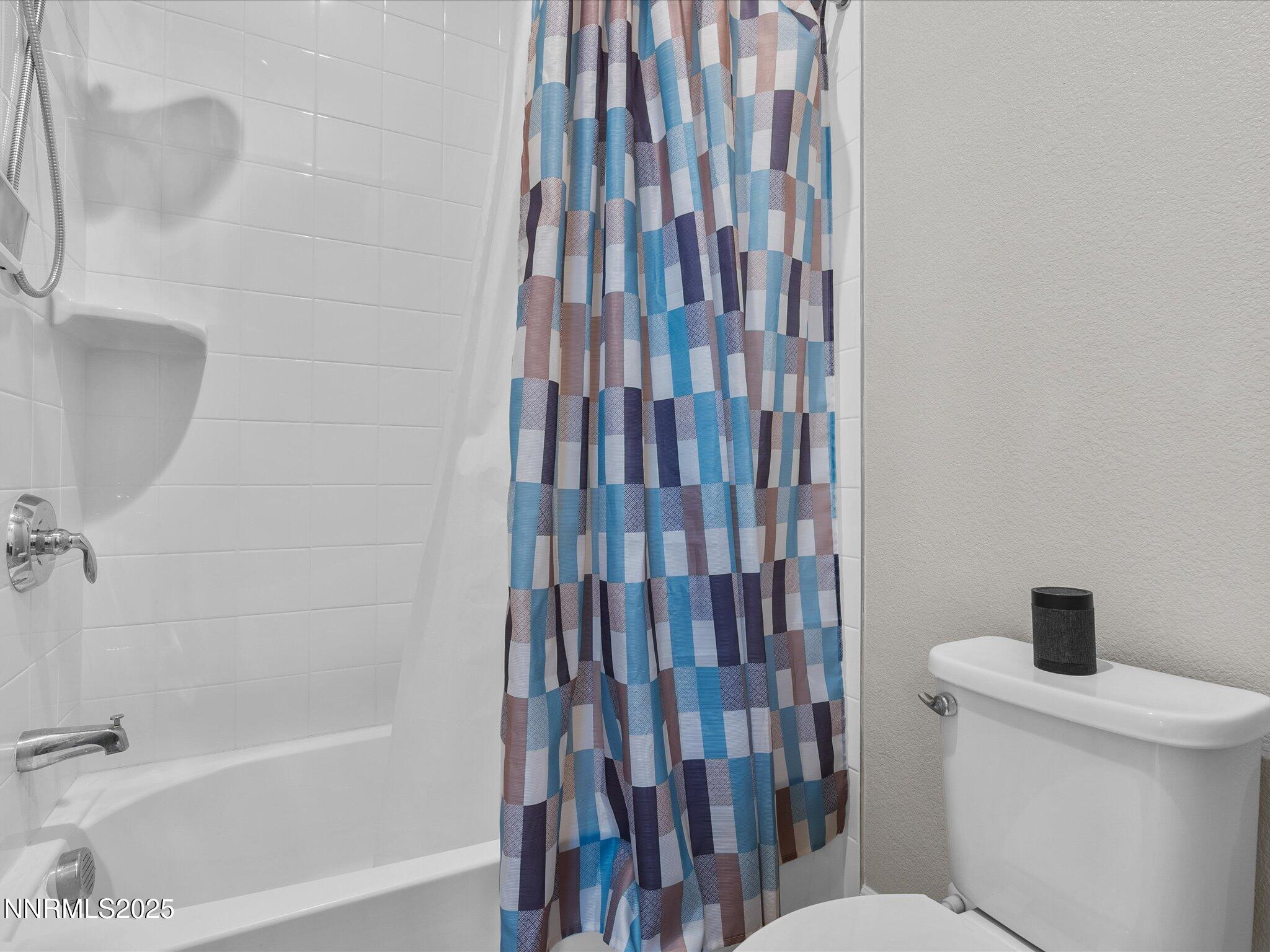 13545 Cobalt Sky Street Reno, NV 89521 - Photo 58 of 96 a bathroom with a toilet and a bathtub