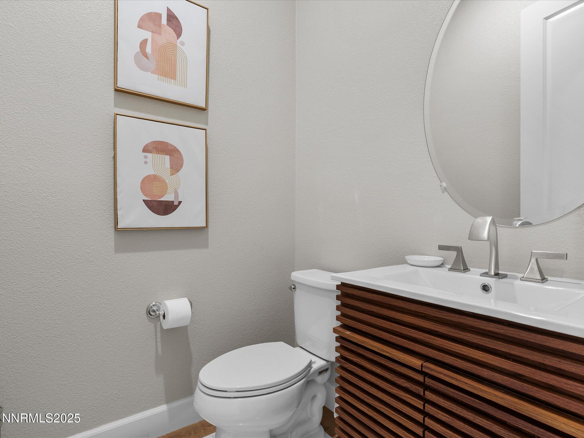 13545 Cobalt Sky Street Reno, NV 89521 - Photo 61 of 96 a bathroom with a sink mirror and toilet