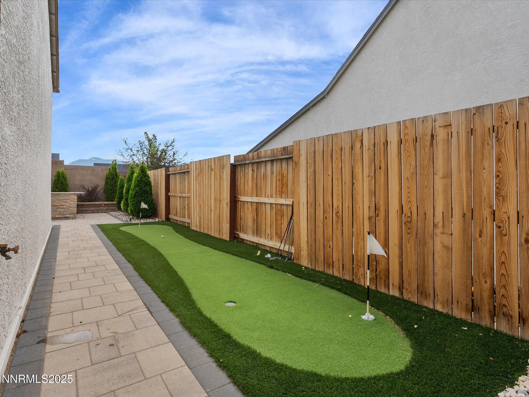 13545 Cobalt Sky Street Reno, NV 89521 - Photo 63 of 96 a view of a backyard with a garden