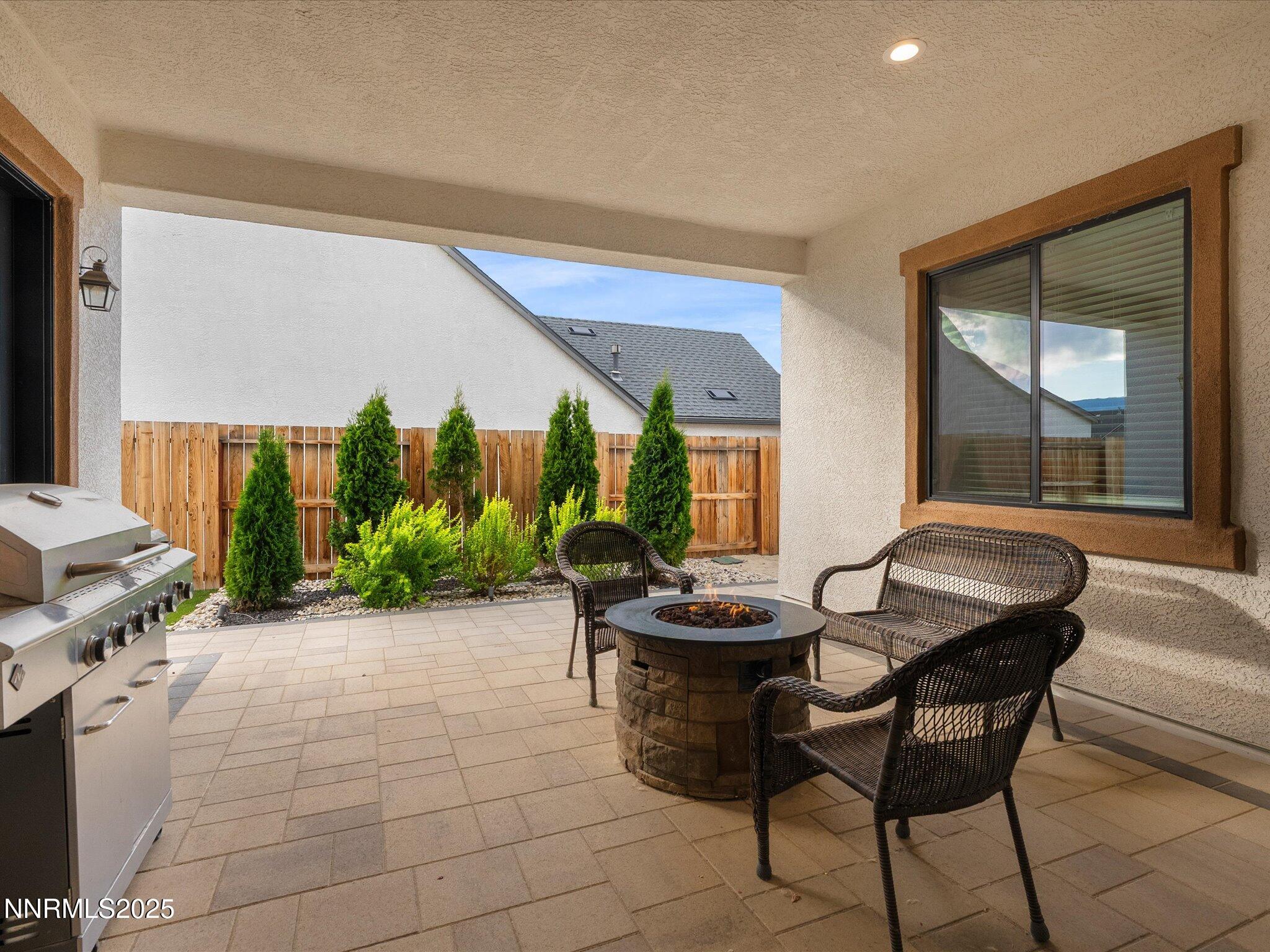 13545 Cobalt Sky Street Reno, NV 89521 - Photo 73 of 96 a dining room with furniture and a floor to ceiling window