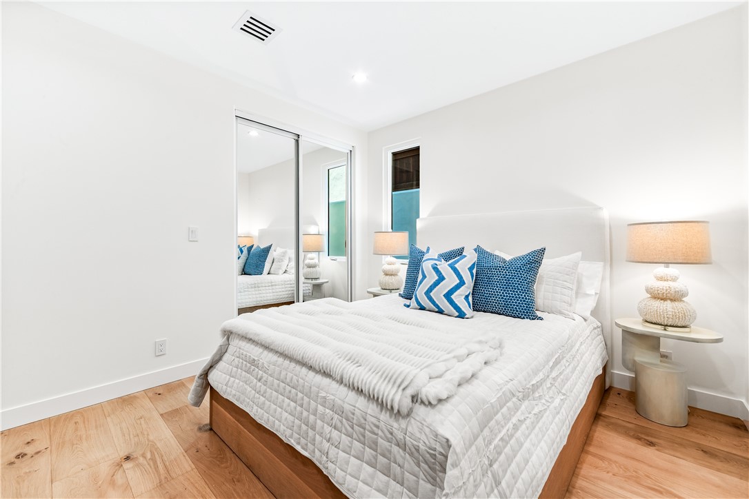 541 4th Street Manhattan Beach, CA 90266 - Photo 13 of 45 a bedroom with a bed and wooden floor