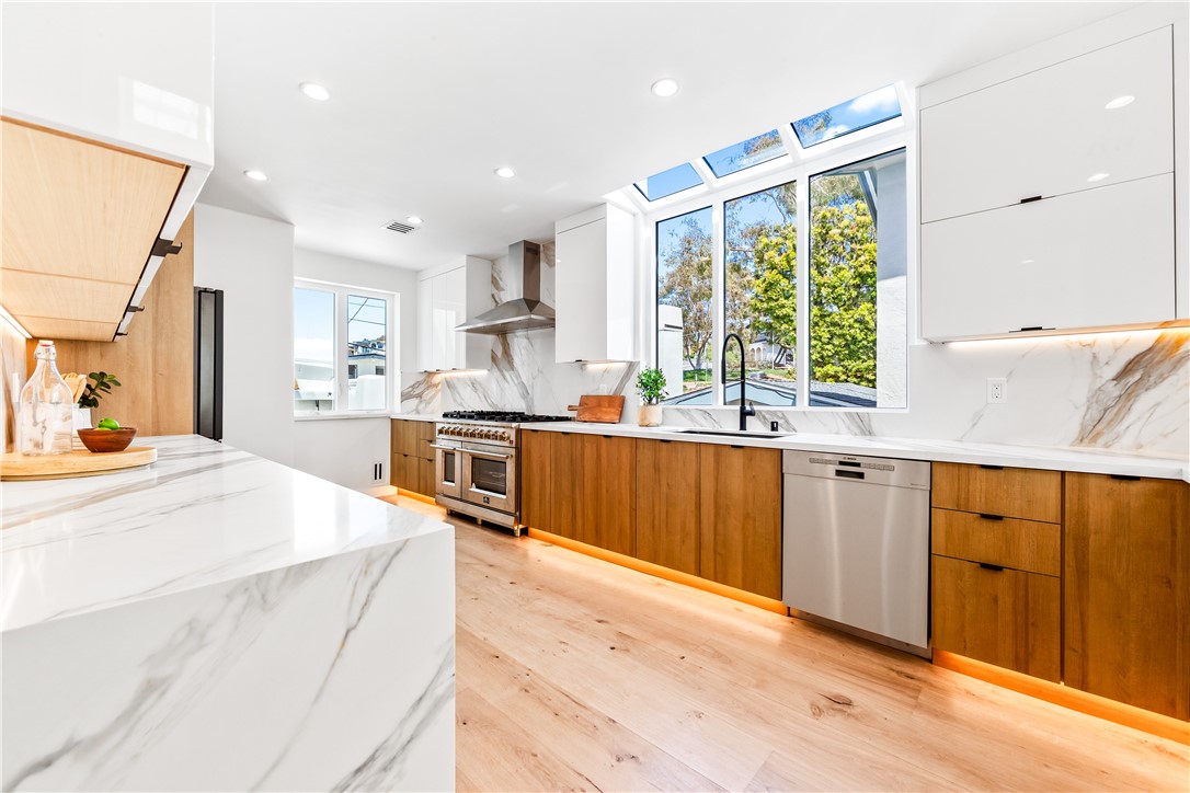 541 4th Street Manhattan Beach, CA 90266 - Photo 23 of 45 a large kitchen with kitchen island a large window a sink and appliances