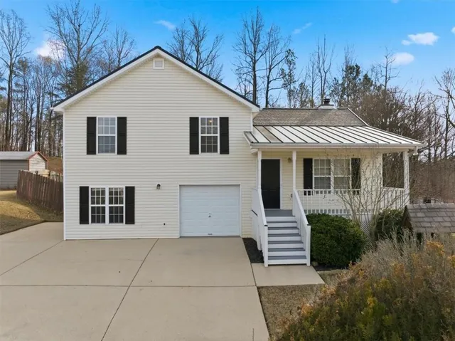 a front view of a house with a garage