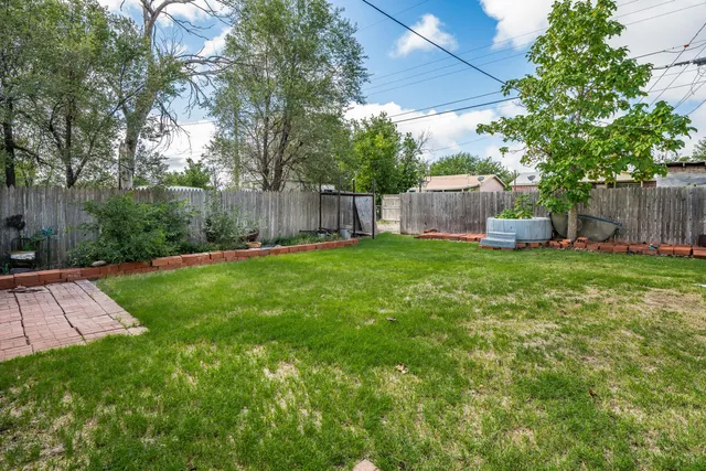 a view of a backyard with a small cabin